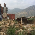 Two men stand in Nepal.