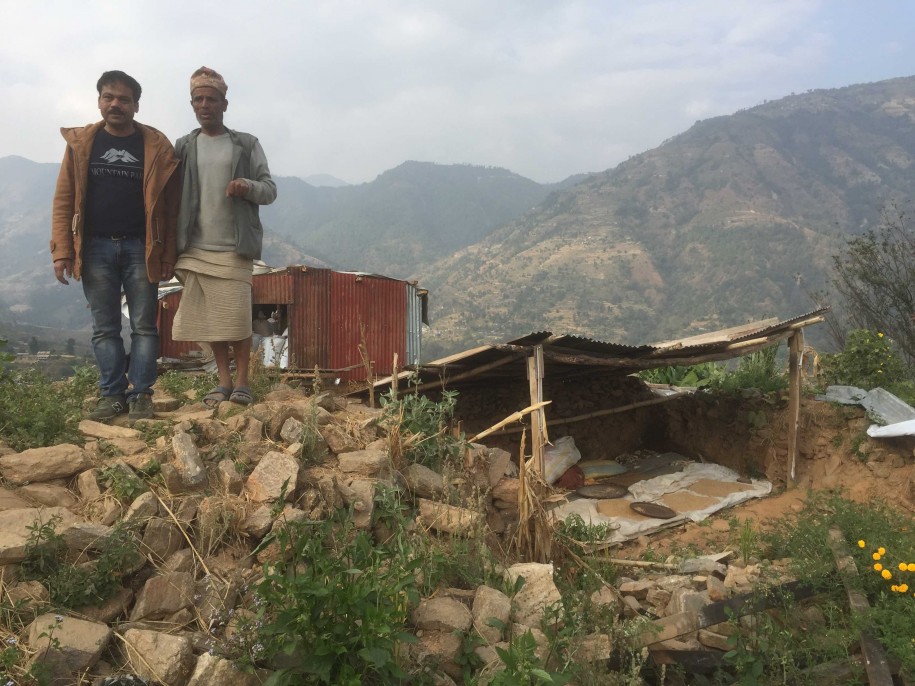 Two men stand in Nepal.