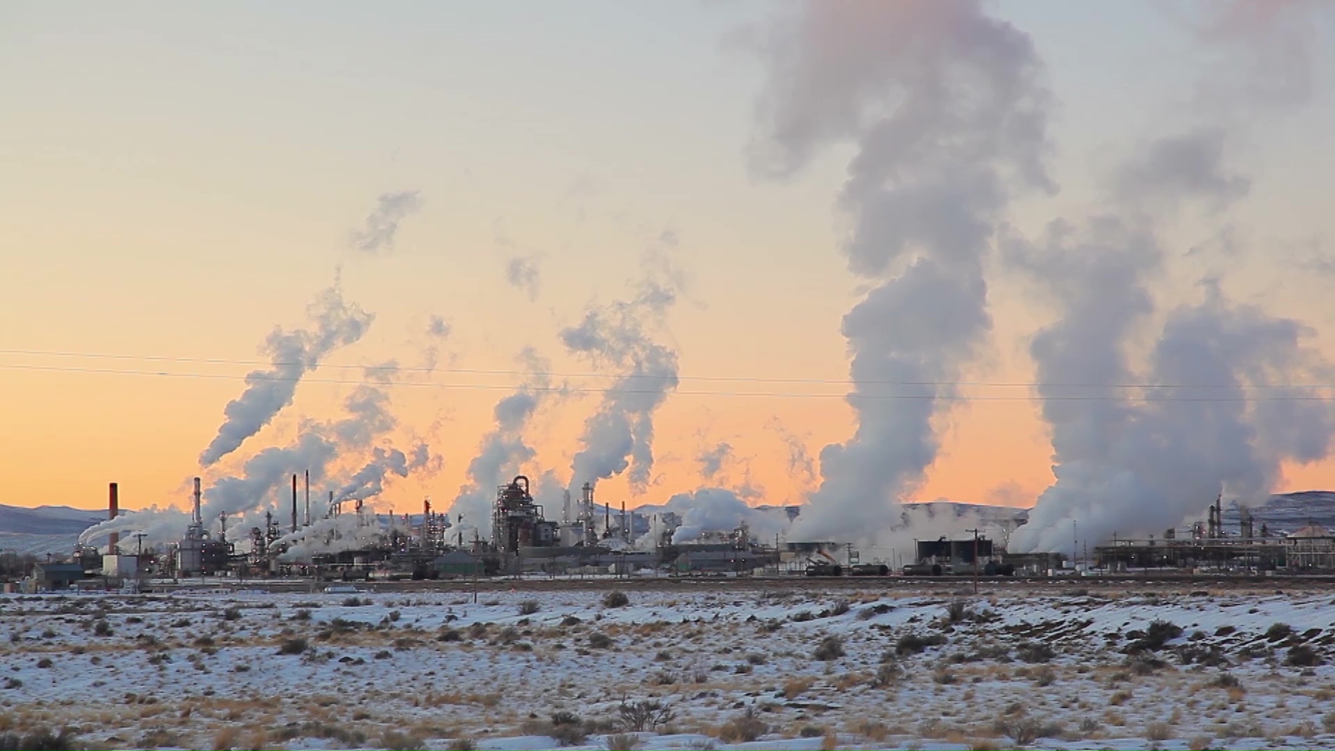 Factories release air pollution.