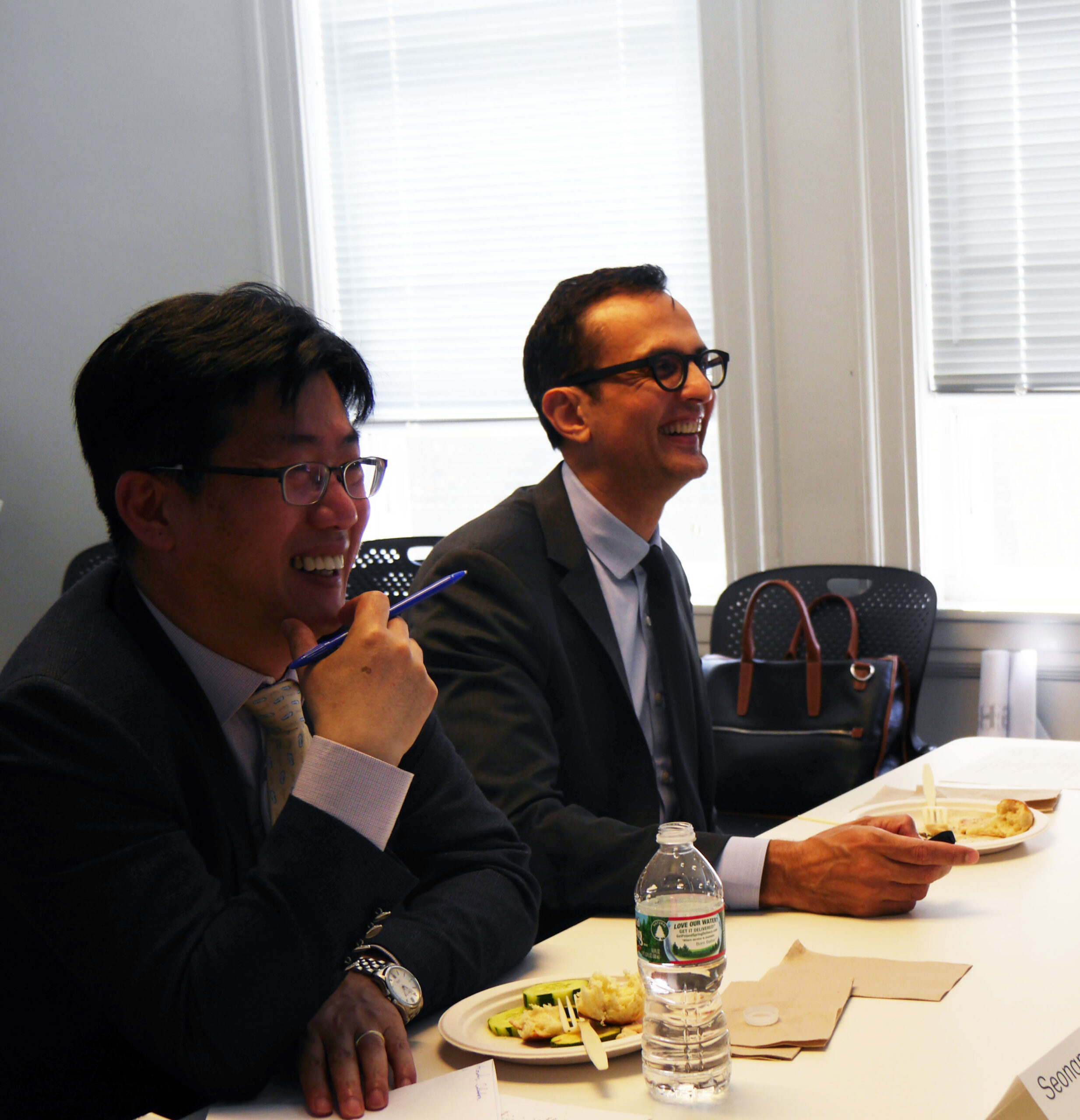 Ali Malkawi sits with member of research team.