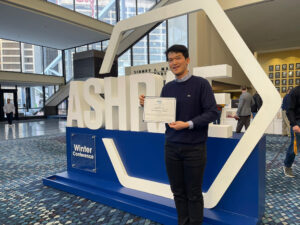 Sunghwan Lim stands with his award for the top doctoral level paper at the ASHRAE Winter Conference.