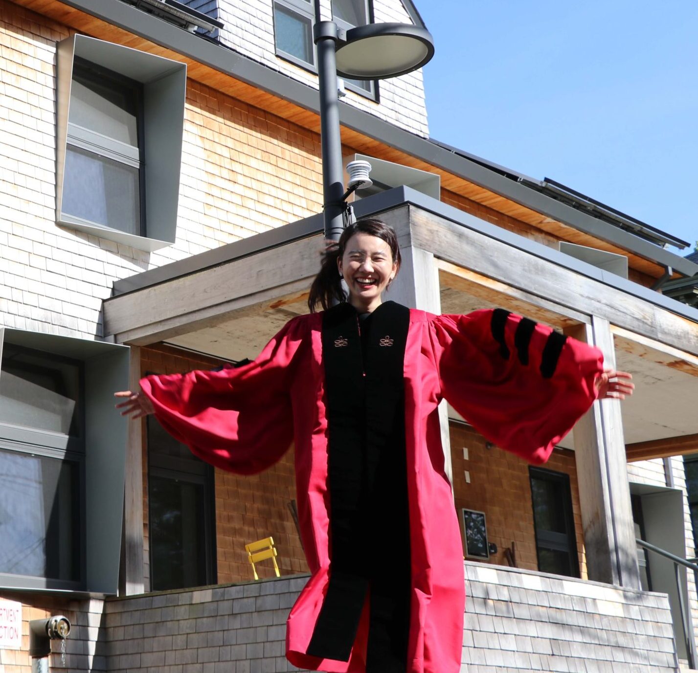 Ellie Jungmin Han stands outside of HouseZero.