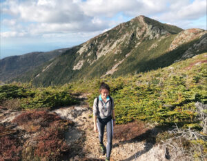 Elence Xinzhu Chen hikes a mountain.