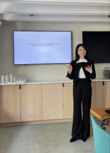 Elence Xinzhu Chen presents on a topic at HouseZero.