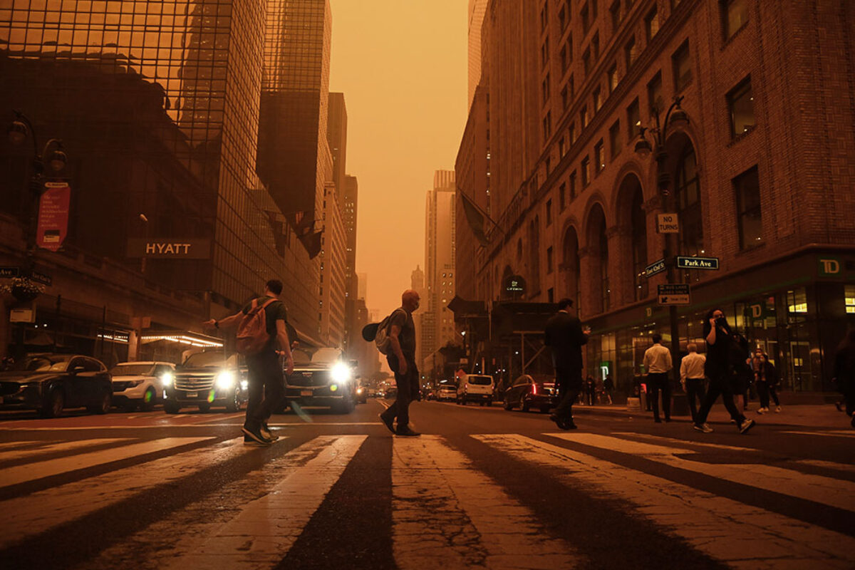 Smoke from Canadian wildfires turns the sky orange.