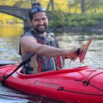 Saurabh Mhatre kayaks on the Charles River.