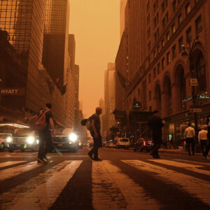 Orange wildfire smoke in the city.
