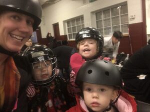 Holly Samuelson and her daughters at hockey practice.
