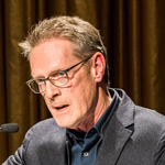 A speaker at the podium at the HouseZero Typology Symposium